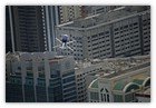 :: Pulse para Ampliar :: Maniobra del piloto de helicóptero alemán Rainer Wilke sobre Abu Dhabi, UAE.