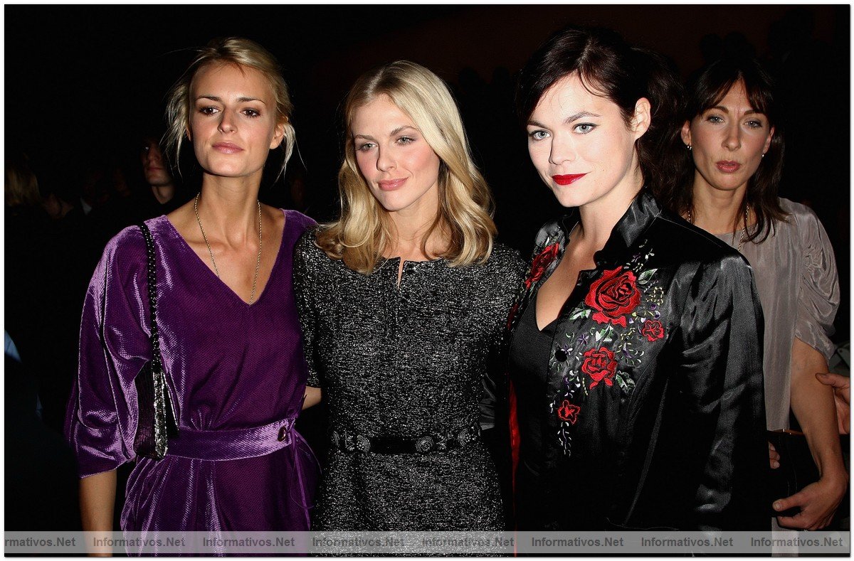 Jaquetta Wheeler, Donna Air and Jasmine Guiness watch from the front row at the Burberry Prorsum Spring/Summer 2010 Show