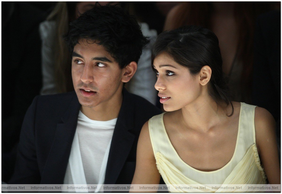 Dev Patel and Freida Pinto watch from the front row at the Burberry Prorsum Spring/Summer 2010 Show