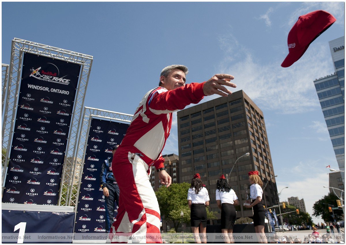British Pilot Paul Bonhomme throws his hat to the crowd from the podium after winning the third round of the 2009 Red Bull Air Race World Championship in Windsor, Canada,  June 14, 2009. Second place was taken by Austria's  Hannes Arch.