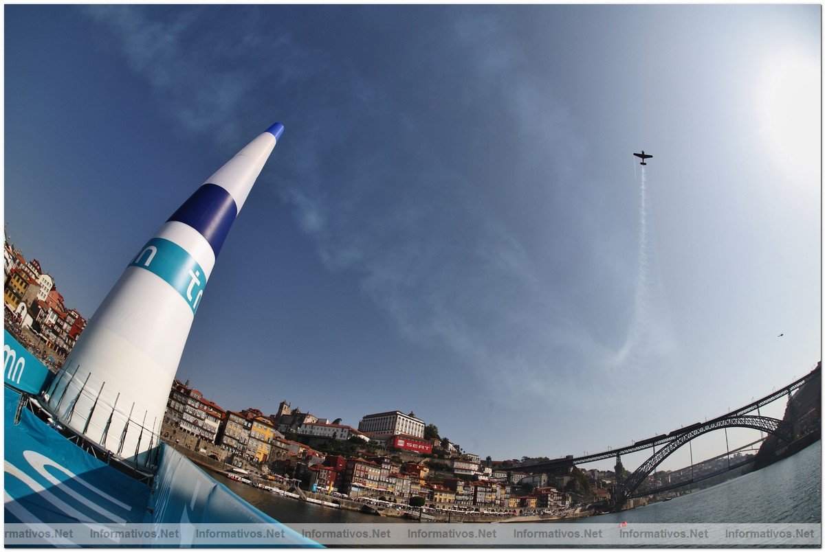 A fisheye lens image from the barge holding  anAir Gate silhouettes a race plane during training ahead of the qualifying round of the fifth round of the 2009 Red Bull Air Race World Championship  in Porto, Portugal,  September 12,  2009.