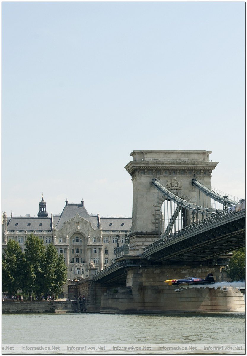 Hungarian pilot Peter Besenyei flying under the historic Chain Bridge ahead of the fourth round of the 2009 Red Bull Air Race World Championship  in Budapest, Hungary,  August  17, 2009.