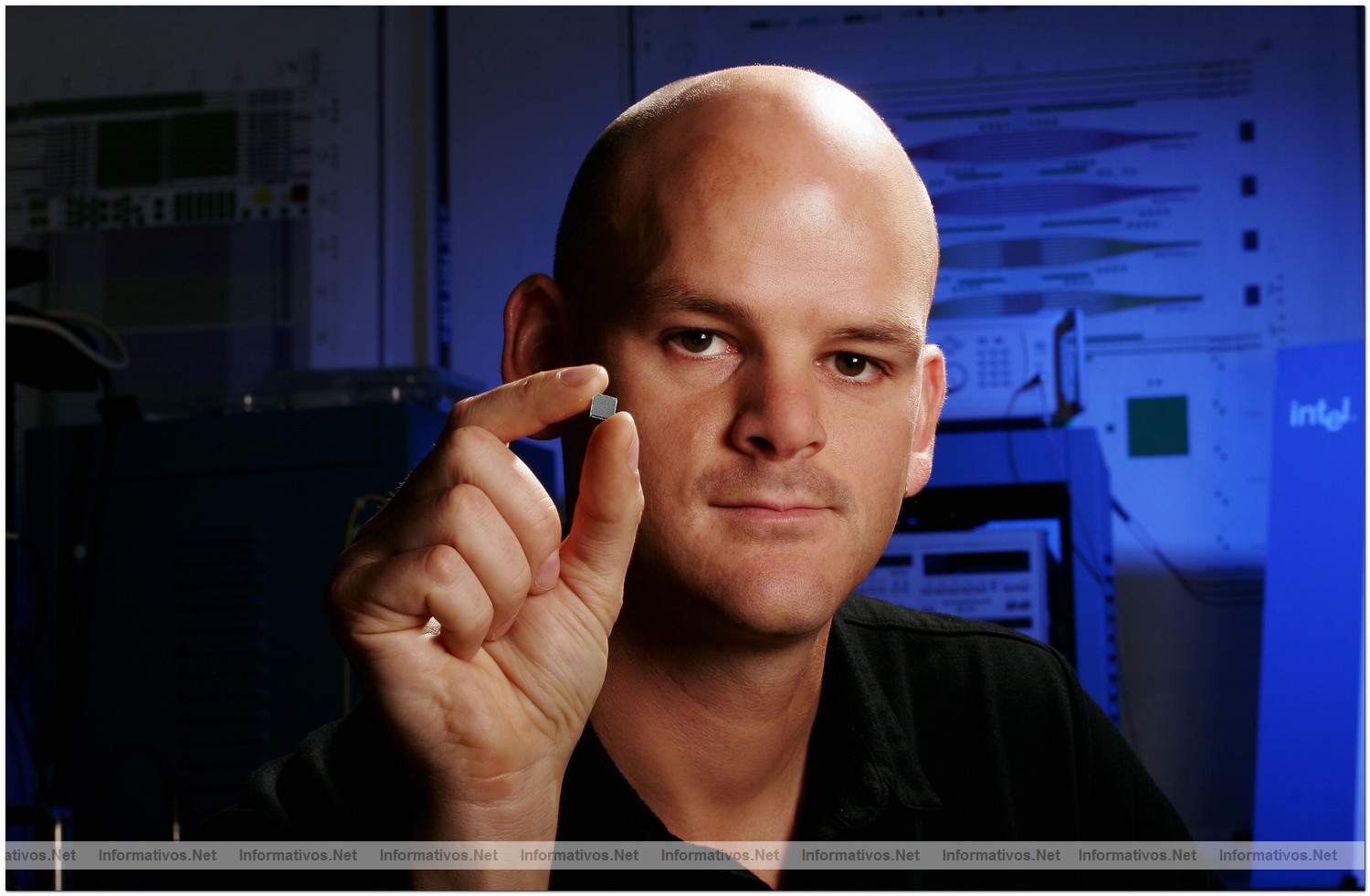 Intel Researcher Richard Jones holds a Hybrid Silicon Laser chip