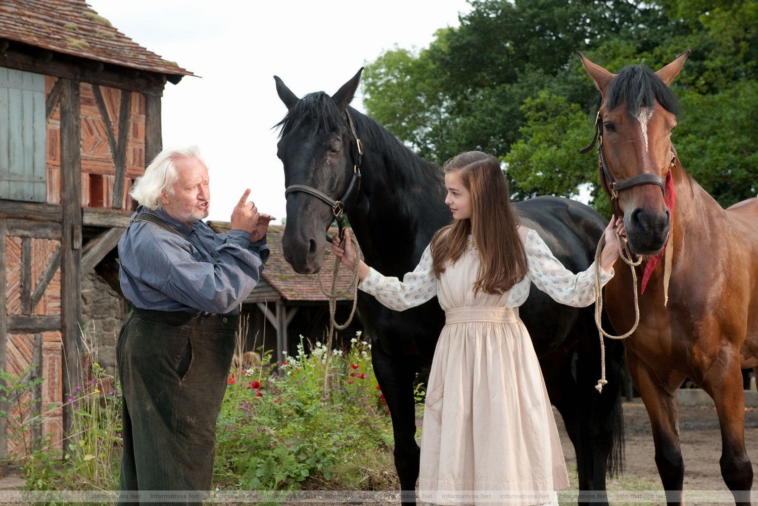 On their farm in the French countryside, Emilie (Celine Buckens) and her Grandfather (Niels Arestrup) with Joey (right) and Topthorn (left) are featured in this scene from DreamWorks Pictures' "War Horse", director Steven Spielberg's epic adventure and an unforgettable odyssey through courage, friendship, discovery and wonder...