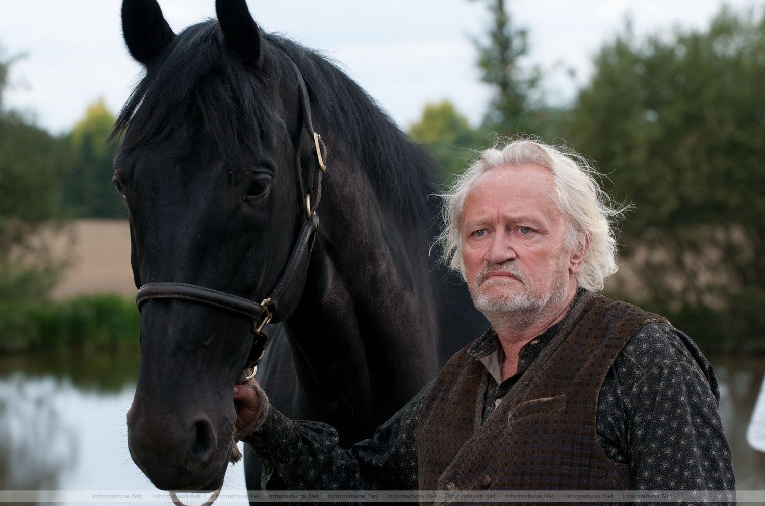 Grandfather (Niels Arestrup), with Topthorn, senses his granddaughter might be in danger in this scene from DreamWorks Pictures' "War Horse", director Steven Spielberg's epic adventure set against a sweeping canvas of rural England and Europe during the First World War.