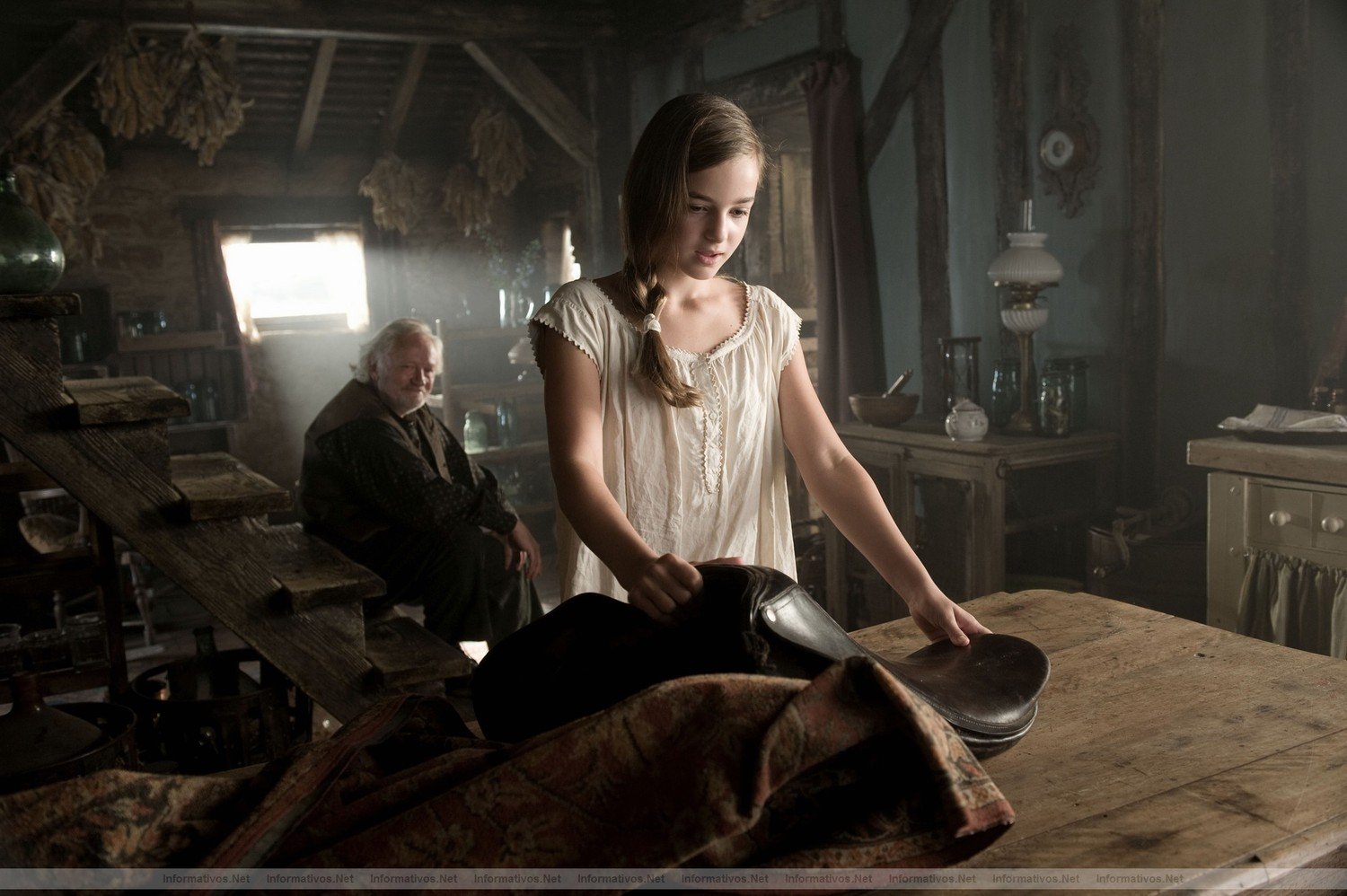 Emilie (Celine Buckens) receives a special birthday gift from her Grandfather (Niels Arestrup) in this scene from DreamWorks Pictures' "War Horse", director Steven Spielberg's epic adventure and an unforgettable odyssey through courage, friendship, discovery and wonder.
