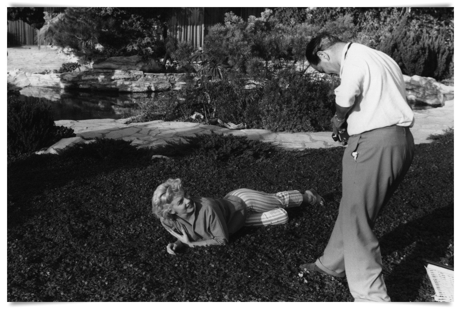 1954:  Hollywood star Marilyn Monroe (Norma Jean Mortenson or Norma Jean Baker, 1926 - 1962) being photographed by Baron at her home in Palm Springs.  (Photo by Baron/Getty Images)