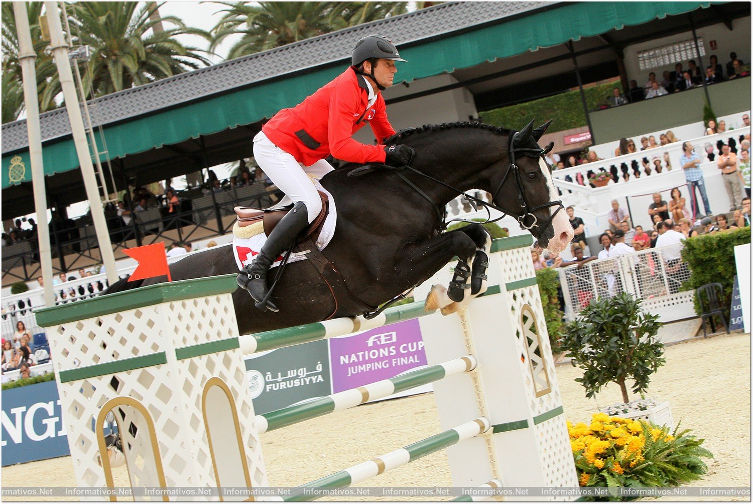 BCN28SEP013.- 102º edición del CSIO Barcelona. Final de consolación de la Furusiyya FEI Nations Cup™ Jumping Final. Beat Mändli, montando a Croesus que roza el obstáculo con la panza sin llegar a derribarlo.