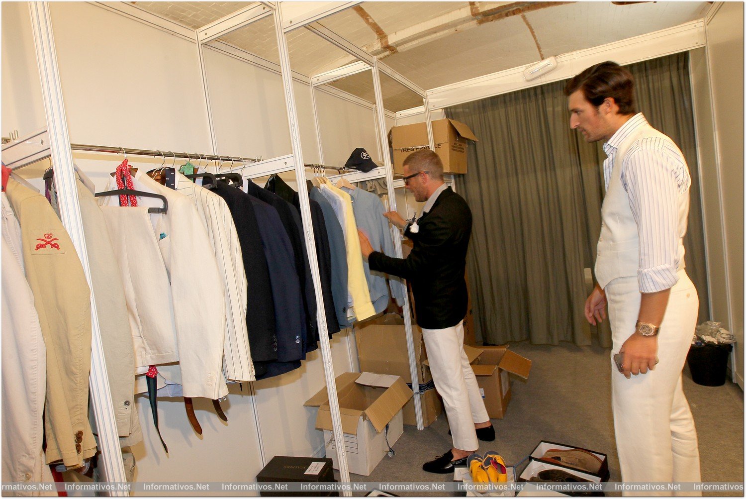 BCN04JUL014.- Rafael Medina, fundador de la marca Scalpers, junto a Lapo Elkann, fundador de la empresa de estilo de vida, Italia Independent, revisando la colección que presentaron en la 080 Barcelona Fashion